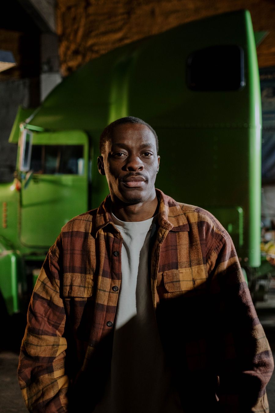 A Murray Boyz Trucking driver standing in front of his tractor unit